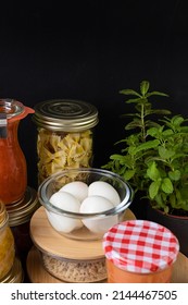 Elegant Batch Cooking Scene Over A Black Background.