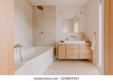 An elegant bathroom with white marble walls and wooden furniture, perfect minimalistic design