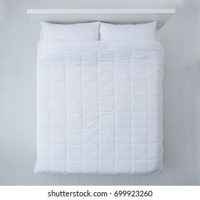 Elegant Bed With Soft White Duvet, Bedding And Pillows, Top View