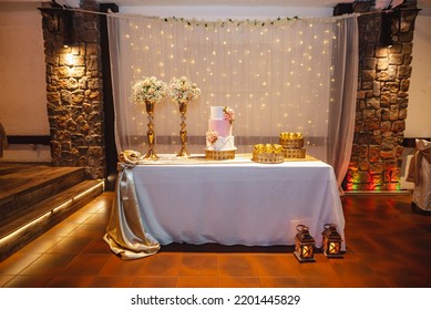 Elegant Birthday Cake With Background Lights And Flowers