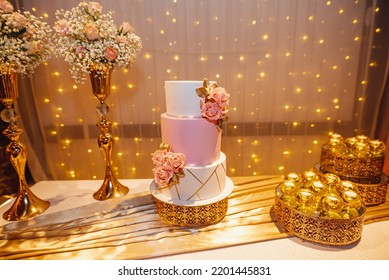 Elegant Birthday Cake With Background Lights And Flowers