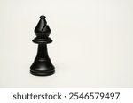 Elegant Black Chess Bishop at left side on white background