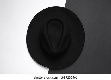 Elegant Black Hat On Color Background, Top View