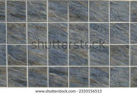 Elegant blue and brown stone tiles square shape for exterior or interior wall. Background and texture.