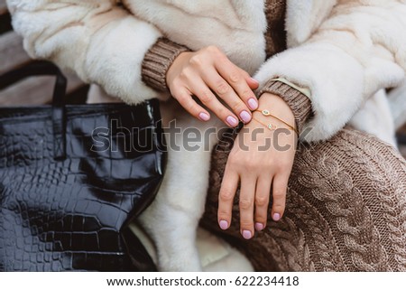 Elegant bracelet on female hands, style for luxury lady