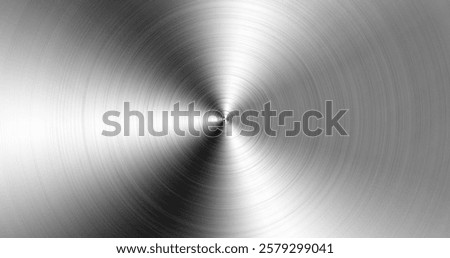 Elegant brushed metal texture with a circular polished stainless steel effect, ideal for industrial design, modern backgrounds, and technology-related projects.