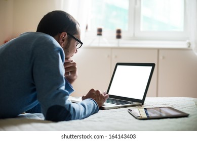 elegant business multitasking multimedia man using devices at home - Powered by Shutterstock