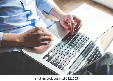 Elegant Business Multitasking Multimedia Man Using Devices At Home