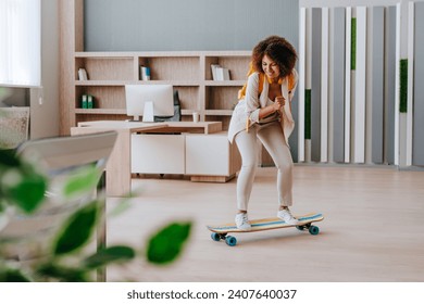 Elegant businesswoman in casual clothes riding on longboard in the modern office. - Powered by Shutterstock