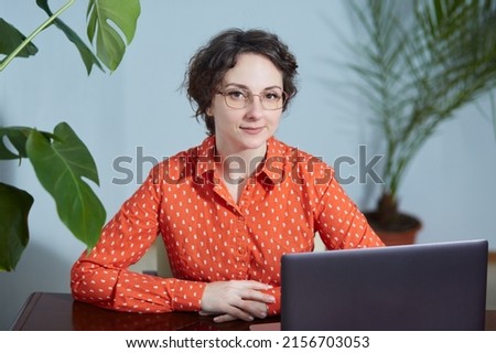 Similar – Image, Stock Photo Smiling businesswoman working at desk with laptop