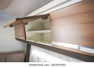 Elegant Camper Van Overhead Cabinet Storage Area. Modern Motorhome RV Recreational Vehicle Features.