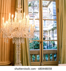 Elegant chandelier in front of window