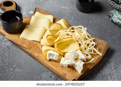 Elegant Cheese Board with Middle Eastern Cheeses - Sulguni, Chechil, Smoked Adyghe Cheese, Imeretian Cheese, and Brined Cheese for Wine Pairing. - Powered by Shutterstock