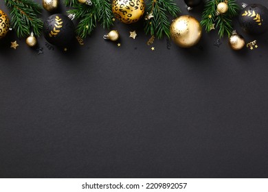 Elegant Christmas Background With Golden Balls, Decorations, Fir Branches On Black Background. Luxury New Year Greeting Card Design, Christmas Banner Mockup