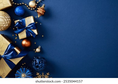 Elegant Christmas decor with gifts, gold and blue ornaments on dark blue background. Xmas holiday greeting card design - Powered by Shutterstock