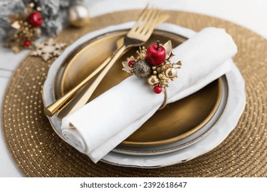 Elegant Christmas place setting table decoration in gold and red, festive centerpiece arrangement on plates close up - Powered by Shutterstock