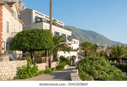 Elegant Coastal Villa Framed by Lush Palm Trees and Majestic Mountains Nearby - Powered by Shutterstock