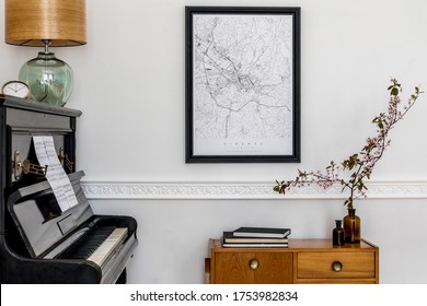 Elegant composition at living room interior with black piano, design commode, black mock up poster map, spring flowers, table lamp and presonal accessories in modern home decor. - Powered by Shutterstock