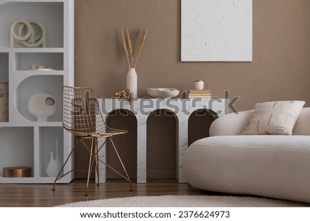 Elegant composition of warm living room interior with mock up poster frame, boucle sofa, marble console, white rack, vase with dried flowers and personal accessories. Home decor. Template.