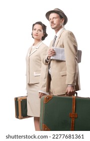 Elegant couple leaving for vacations with luggage, 1950s style - Shutterstock ID 2277681361