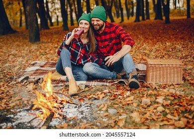 Elegant couple spend time in a autumn park - Powered by Shutterstock