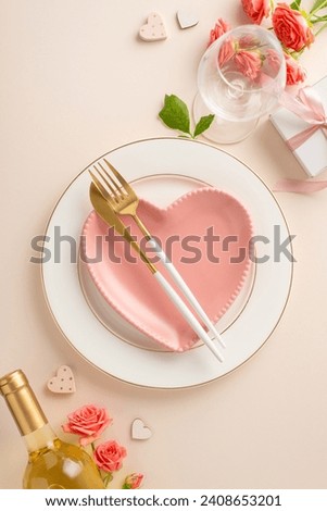 Elegant Date Night: vertical top-down view captures the essence of a romantic dinner setting. Heart-shaped plate, cutlery, white wine, roses, themed decor on pastel beige surface for heartfelt message
