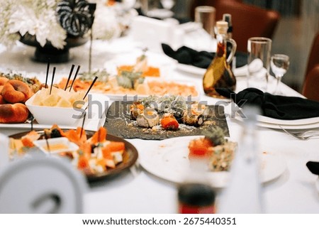 Elegant dining experience featuring assorted dishes at a beautifully set table in a restaurant