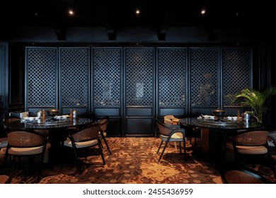 An elegant dining setup in a high-end restaurant with ornate lattice partitions and luxurious decor - Powered by Shutterstock