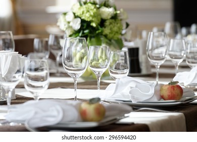 Elegant Dinner Table Setting In Restaurant Or Hotel With Wine Glasses