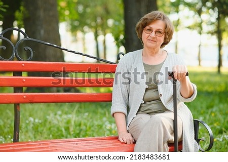 Similar – Smiling senior woman in wheelchair