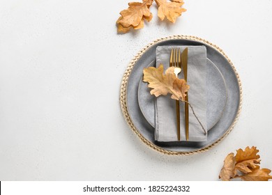 Elegant Fall Grey Table Setting With Autumn Leaves On White Table. View From Above. Space For Design.