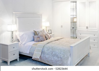 Elegant fancy white bedroom with double bed
