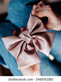 Elegant Fashion Design Accessories For Girls. Hair Bow In Young Woman Hands 