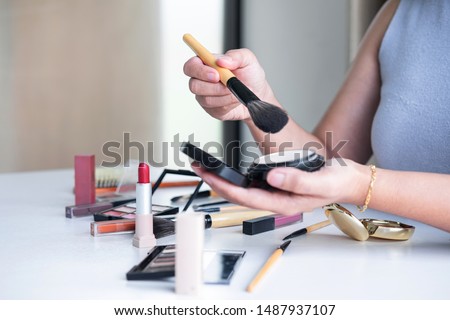 Elegant female Beauty blogger showing testing beauty cosmetic using product makeup tutorial cosmetics and sale product.
