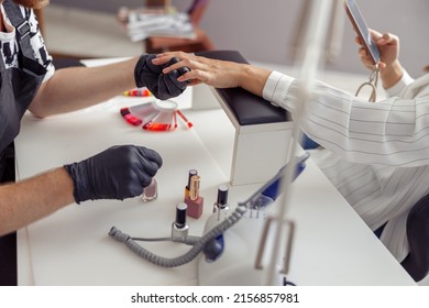 Elegant Female Having Nail Manicure In Nail Art Studio