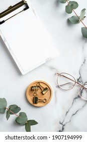 Elegant Feminine Workspace With Clipboard, Office Supplies, Glasses On Marble Background. Home Office Desk Table Top View.