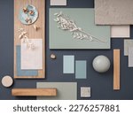 Elegant  flat lay composition in green, blue and beige color palette with textile and paint samples, lamella panels and tiles. Architect and interior designer moodboard. Top view. Copy space. 
