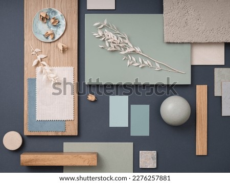 Elegant  flat lay composition in green, blue and beige color palette with textile and paint samples, lamella panels and tiles. Architect and interior designer moodboard. Top view. Copy space. 