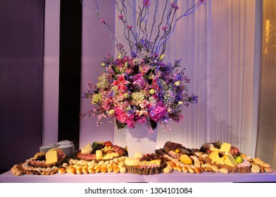 Elegant floral centrepiece made out of hydrangeas, scented lilies, gerbera daisies and alstroemerias with full continental style buffet table underneath.