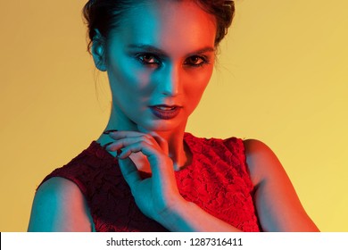elegant girl with expressive look with color light