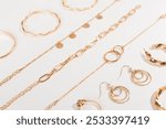 Elegant golden jewelry with decoration on color background