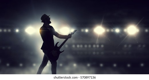 Elegant Guitarist Silhouette . Mixed Media