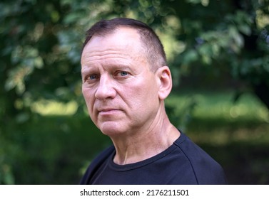 Elegant Handsome Middle-aged Man 55-60 Years Old, Wearing A Black T-shirt, Close-up Portrait