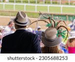 Elegant hats and fancy attire at the horse races 