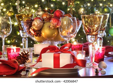 Elegant  Holiday Table Setting With Red Ribbon Gift