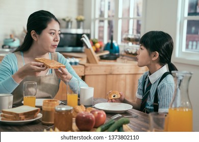 Elegant Housewife Mother And Cute Daughter Eating Togetherness Cheerful Concept. Young Mom And Kid Having Healthy Breakfast After Dad Leaving Home Going Work. Parent Enjoy Morning Time With Child.