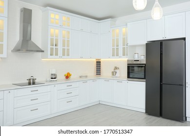 Elegant interior of new kitchen with stylish furniture