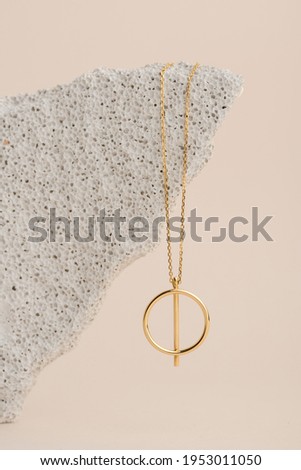 Elegant jewelry set of the gold pendant. Jewelry pendant. Product still life concept