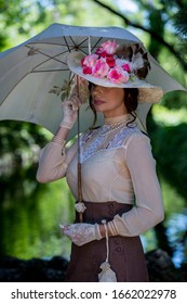 Elegant Lady, From High Society Of The Twentieth Century, Walking Through A Public Park
