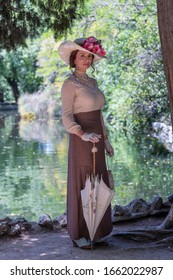 Elegant Lady, From High Society Of The Twentieth Century, Walking Through A Public Park
